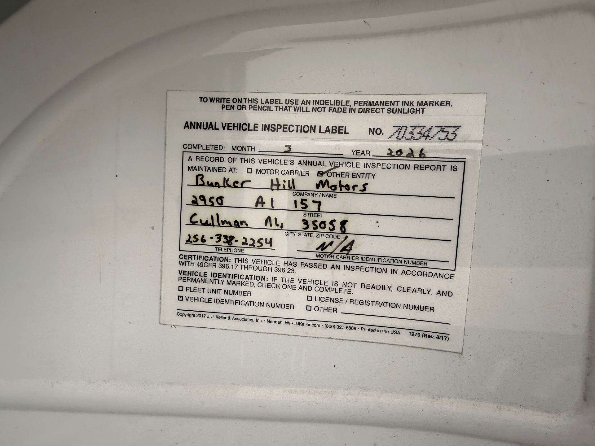 Annual vehicle inspection label completed March 2026 by Bunker Hill Motors