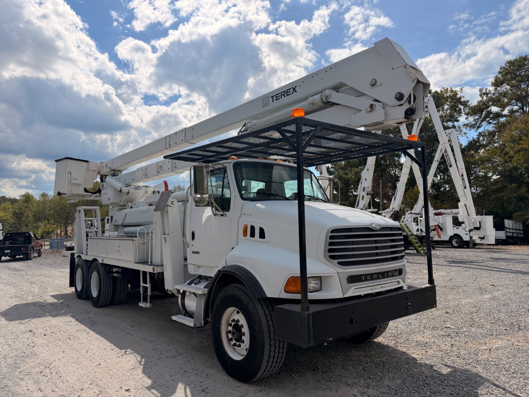 Three-quarter front view with folded Terex boom