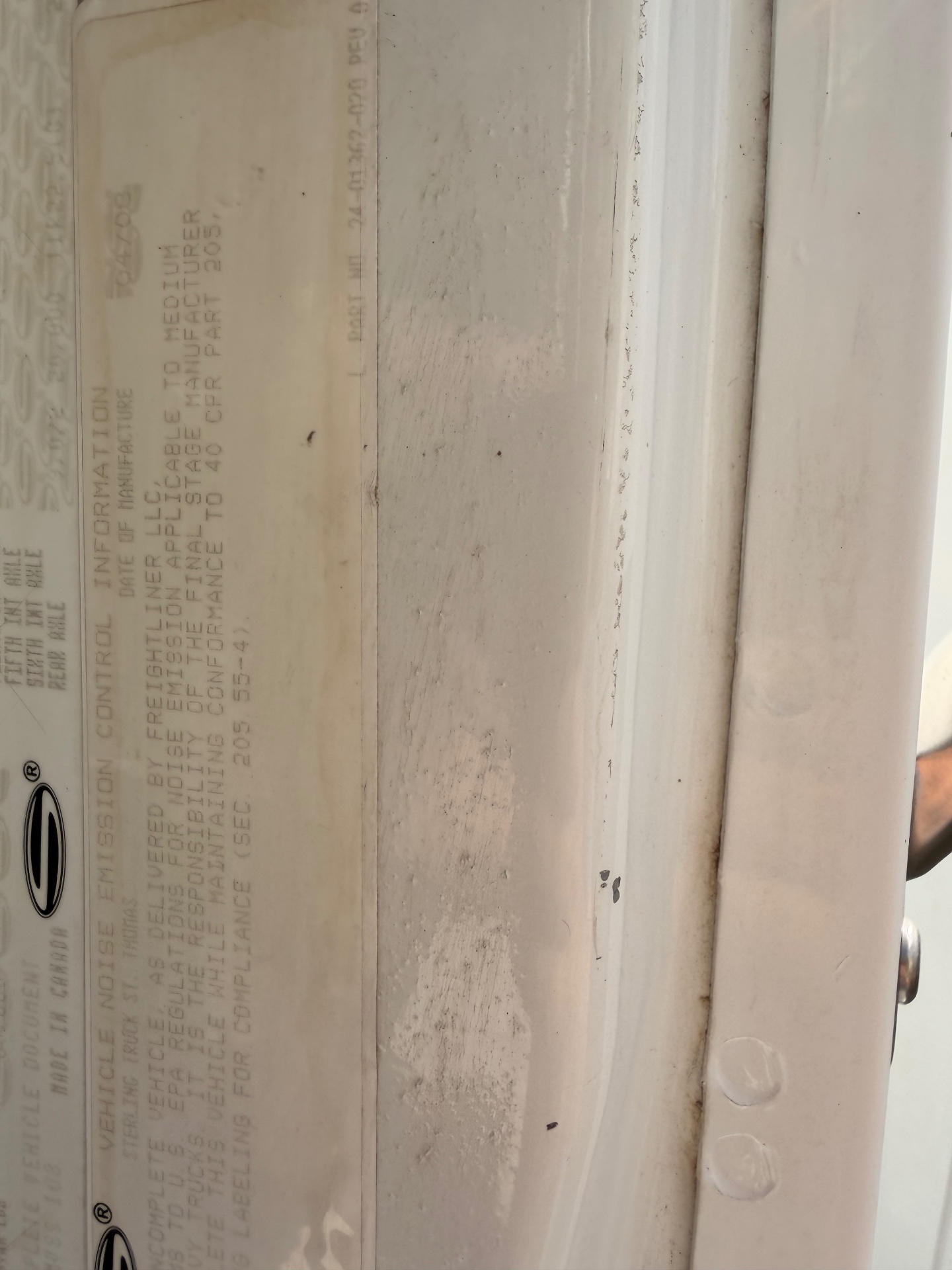 Door-jamb emission and manufacturer label